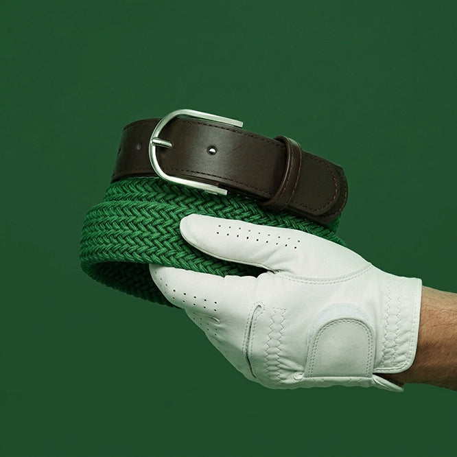 Golf belts for the golf season, a hand with white golf glove holding a Beltology golf belt